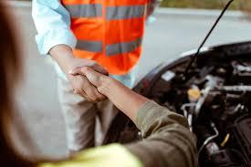 mechanic helping roadside car